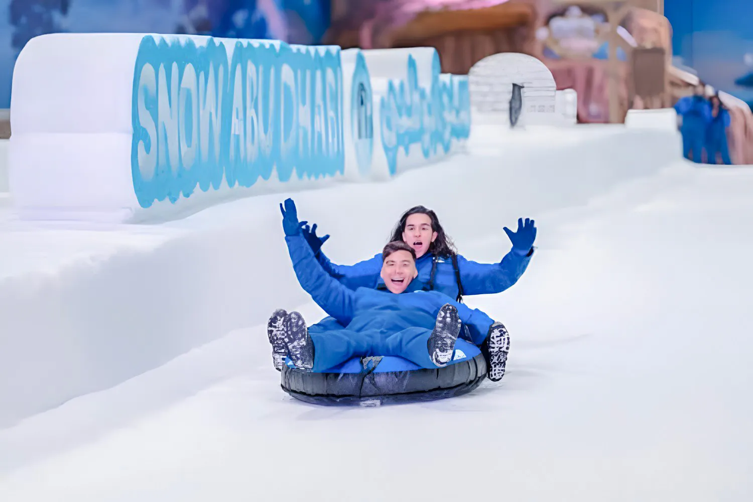 Visitors tubing at Snow Abu Dhabi indoor snow park, Abu Dhabi.