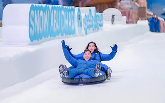 Visitors tubing at Snow Abu Dhabi indoor snow park, Abu Dhabi.
