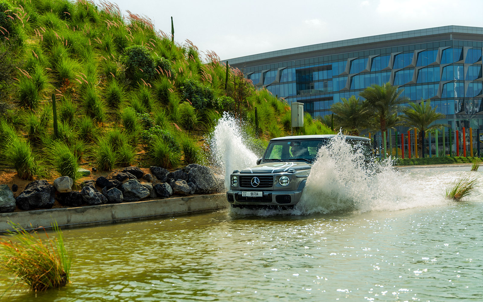 Mercedes-Benz driving through water at Dubai experience tour.