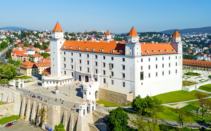 Bratislava Castle with red rooftops overlooking the cityscape in Slovakia.