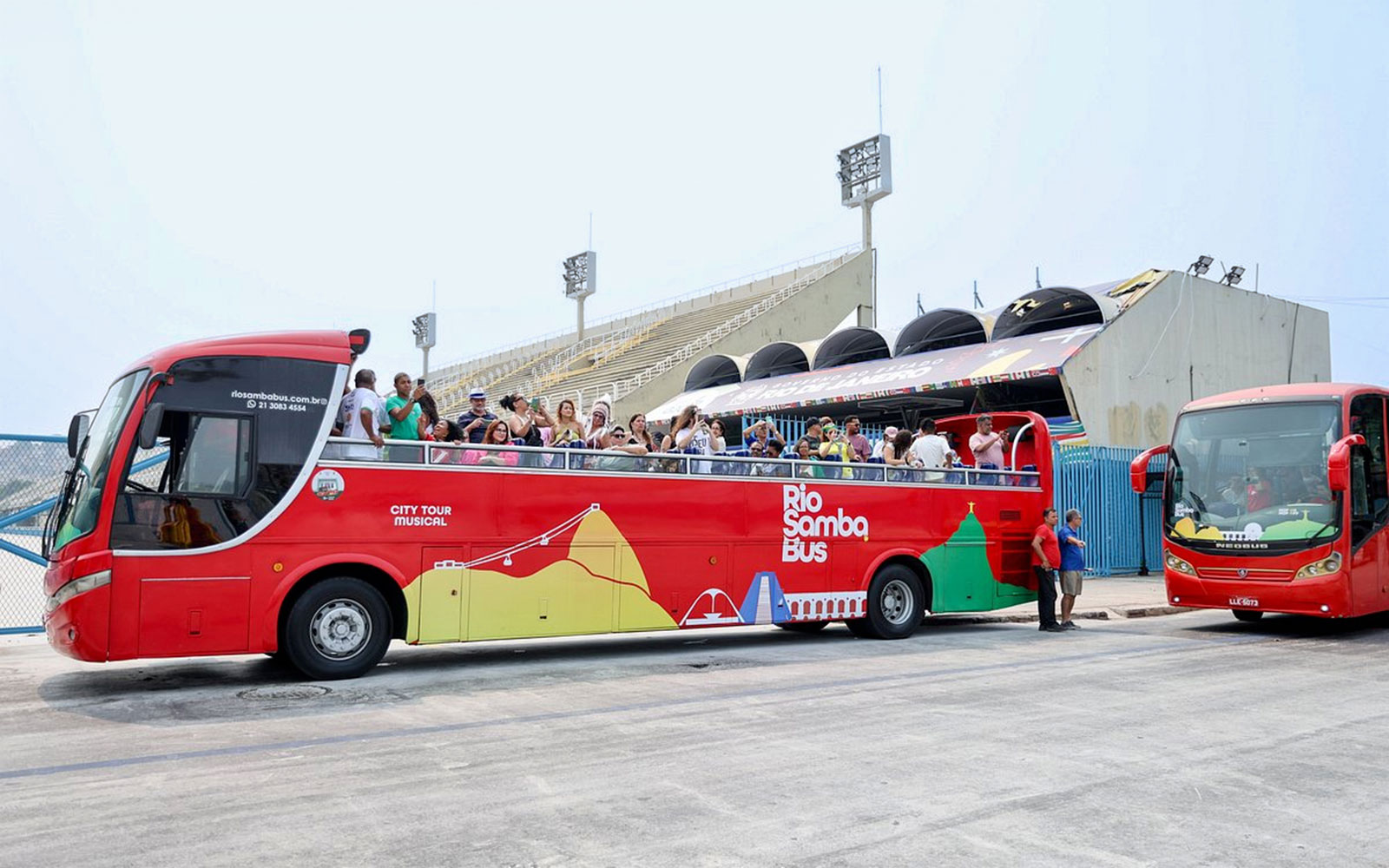 Rio de Janeiro hop-on hop-off bus with tourists at Sambadrome.