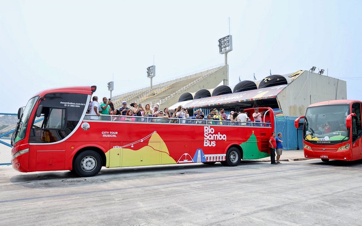 Rio de Janeiro hop-on hop-off bus with tourists at Sambadrome.