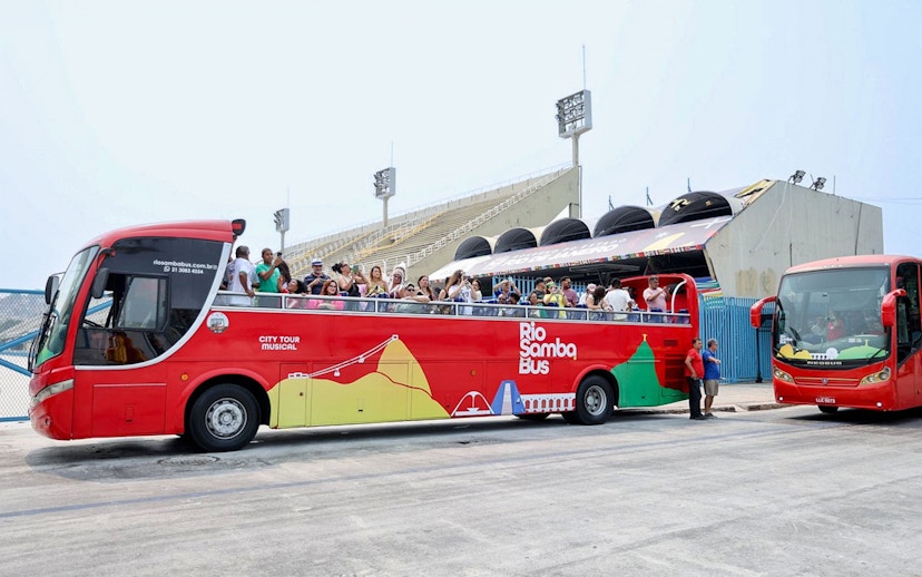 Rio de Janeiro hop-on hop-off bus with tourists at Sambadrome.