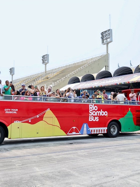 Rio de Janeiro hop-on hop-off bus with tourists at Sambadrome.