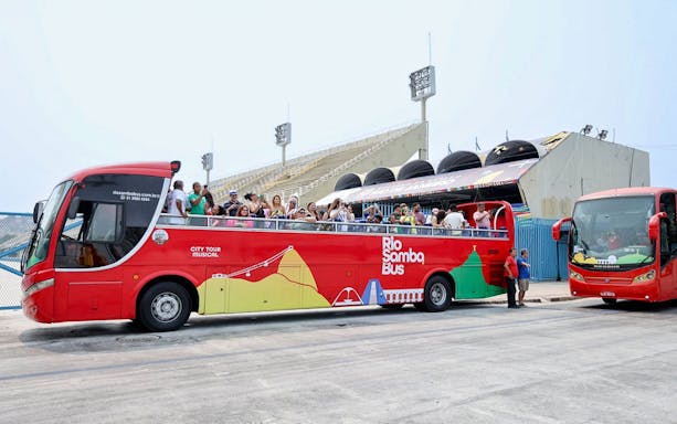 Rio de Janeiro hop-on hop-off bus with tourists at Sambadrome.