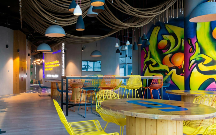 Colorful seating area with vibrant wall art at Qatar Olympic and Sports Museum, Doha.