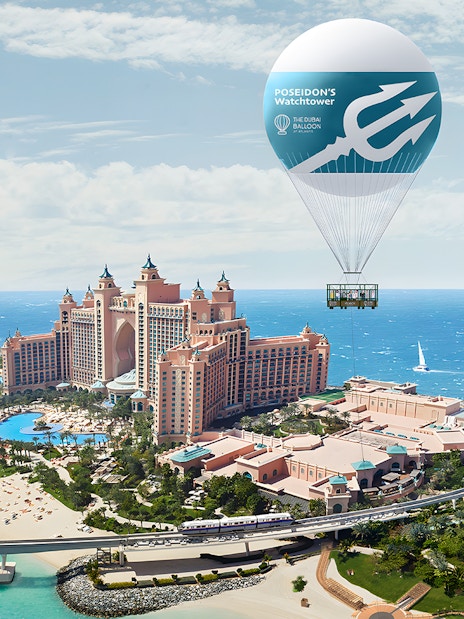 Hot air balloon over Atlantis The Palm, Dubai with ocean view.