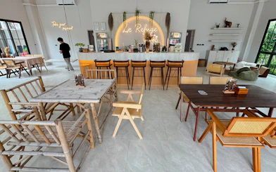 Le Refuge café interior with bamboo furniture and bar in Pattaya.