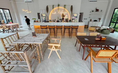Le Refuge café interior with bamboo furniture and bar in Pattaya.