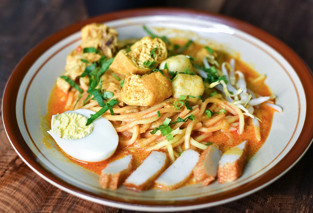 Chicken ramen bowl with sliced green onions and soft-boiled.
