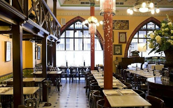 Dining area at Els Quatre Gats, showcasing Catalan decor, part of the Barcelona Modernist Architecture Tour.