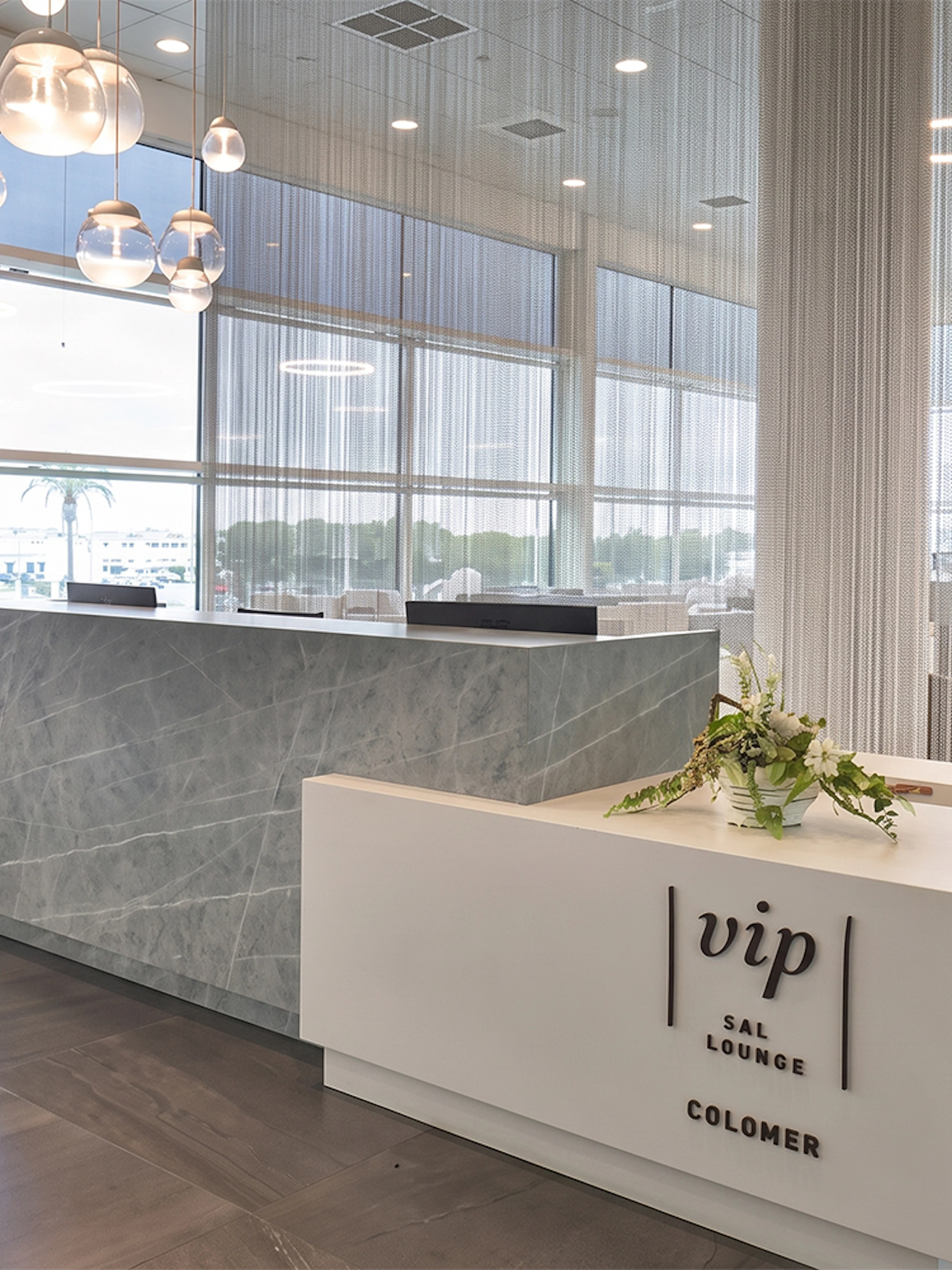 Colomer VIP Lounge reception area at Barcelona El Prat Airport Terminal 1.