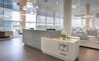Colomer VIP Lounge reception area at Barcelona El Prat Airport Terminal 1.