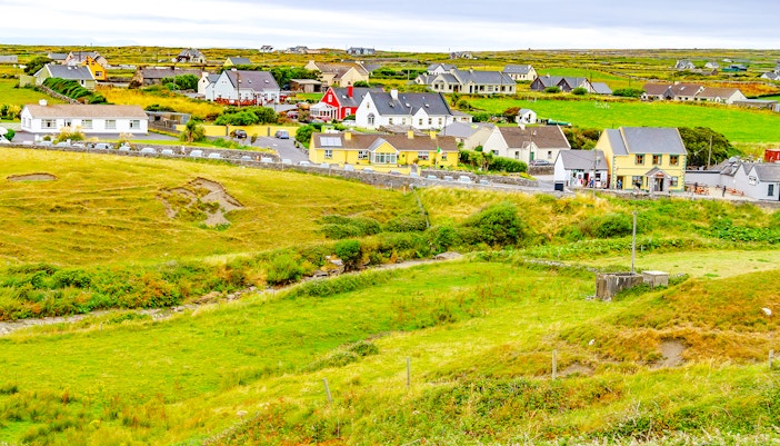 Doolin Village landscape with colorful houses and green fields in County Clare, Ireland.