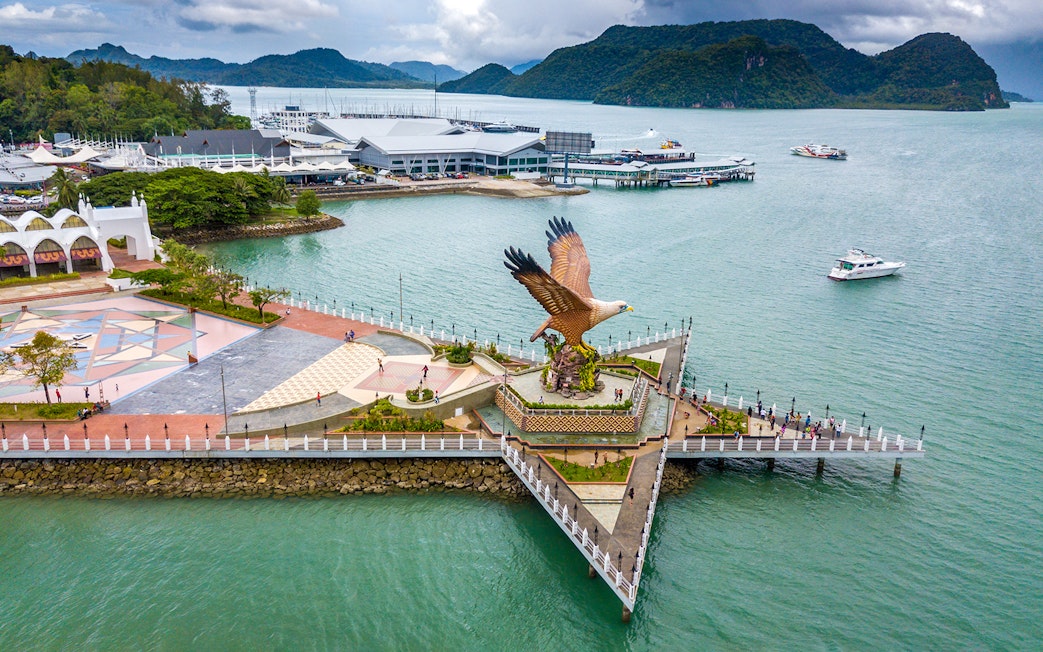 Eagle Square in Langkawi with boats and mountains in the background.