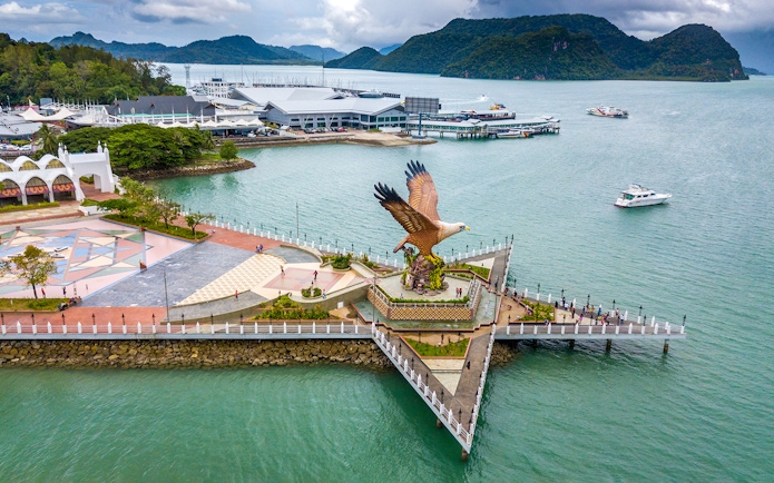 Eagle Square in Langkawi with boats and mountains in the background.
