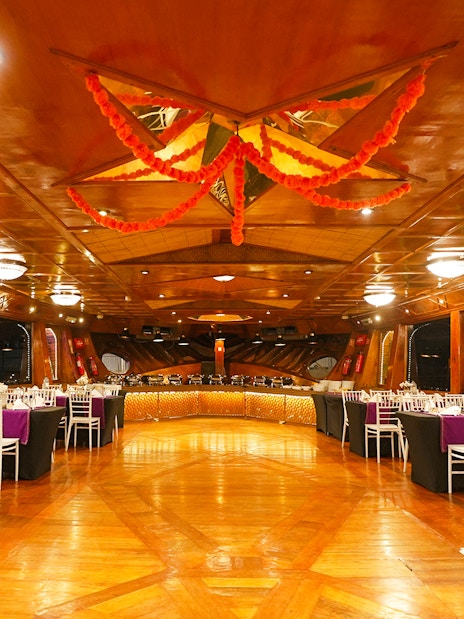 Luxury dining setup on a dhow cruise in Dubai Marina with elegant table arrangements.