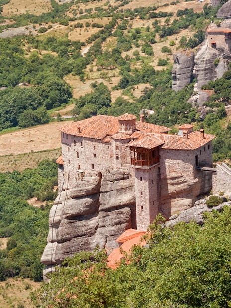 Monastery perched on rock formations in Meteora, Greece, seen during a private day tour from Athens.