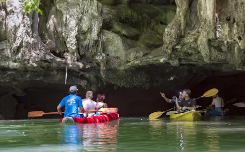Canoeing through sea caves with monkeys at Phang Nga Bay, Phuket.