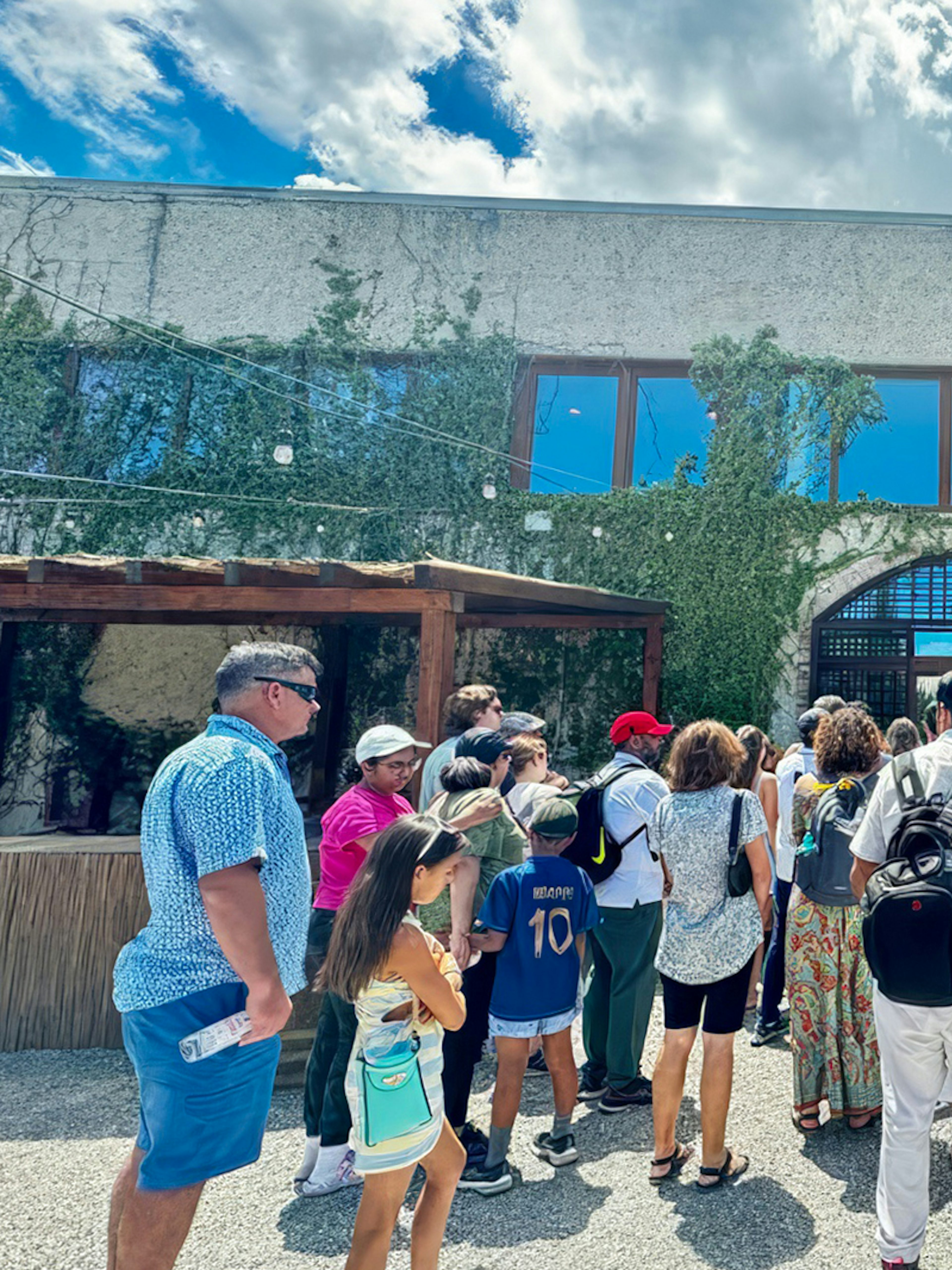 Visitors entering Poggio ai Laghi winery in Chianti, Italy.