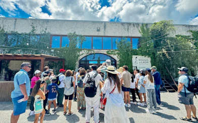 Visitors entering Poggio ai Laghi winery in Chianti, Italy.