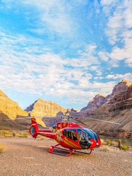 Helicopter on the Grand Canyon rim with scenic canyon views, Arizona.
