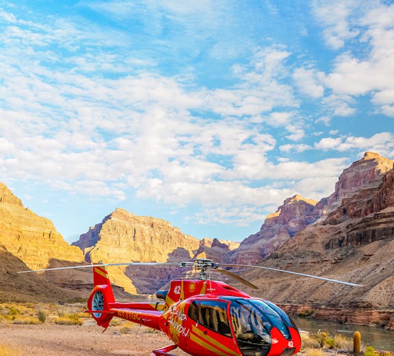Helicopter on the Grand Canyon rim with scenic canyon views, Arizona.