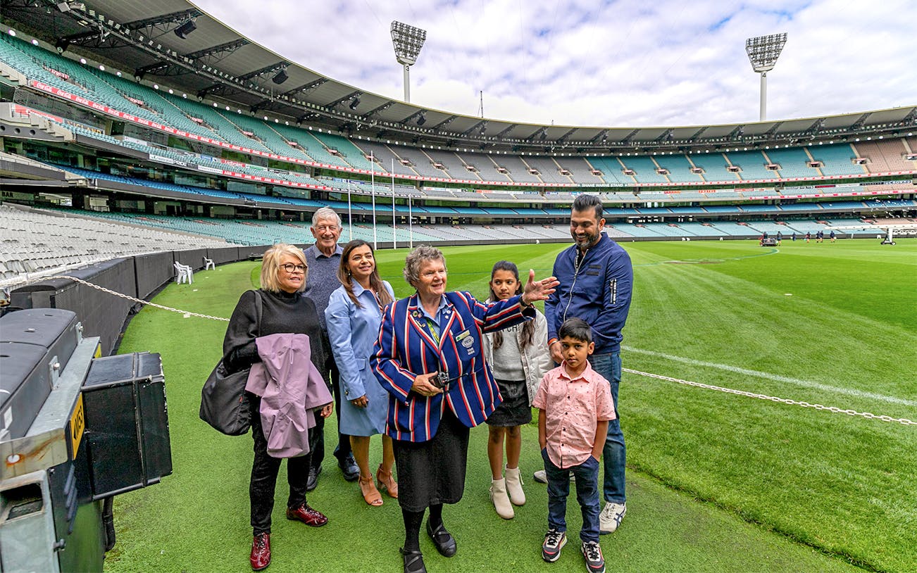 Tour group with guide at Melbourne Cricket Ground.
