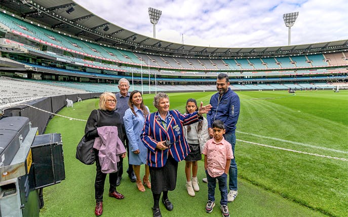 Tour group with guide at Melbourne Cricket Ground.