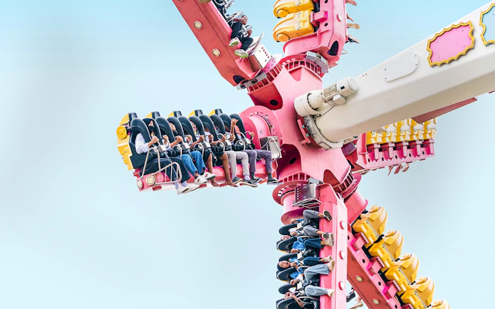 Visitors on a spinning ride at Dunia Fantasi Dufan Theme Park.