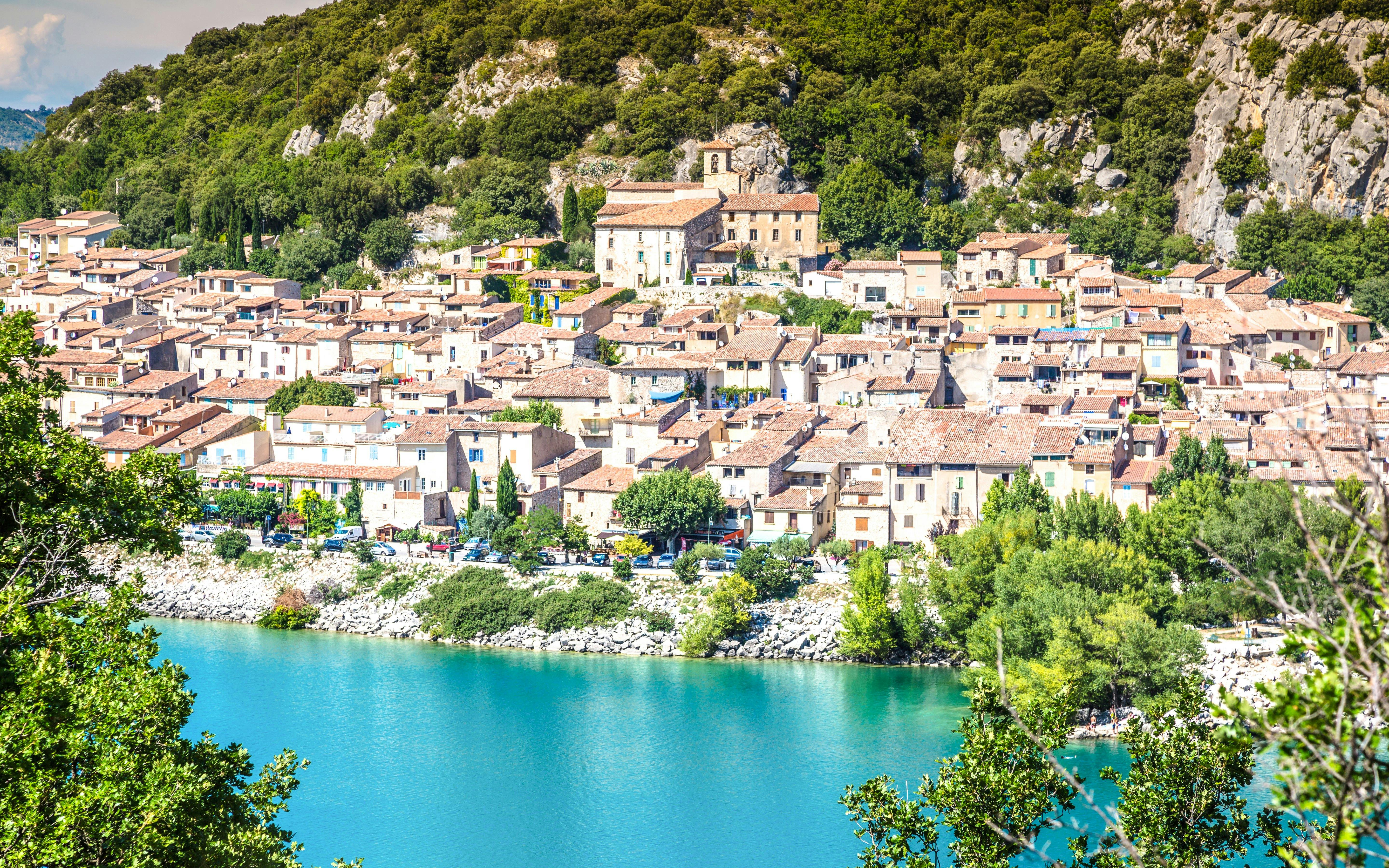 Village by Lake of Sainte-Croix with Gorges du Verdon backdrop.