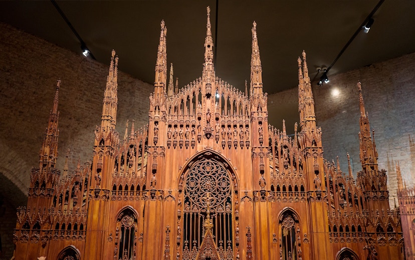 Wooden model of Milan Duomo at the museum, showcasing intricate architectural details.