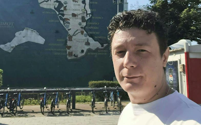 Mural map of Constanta with bicycles in foreground, part of self-guided city exploration game.