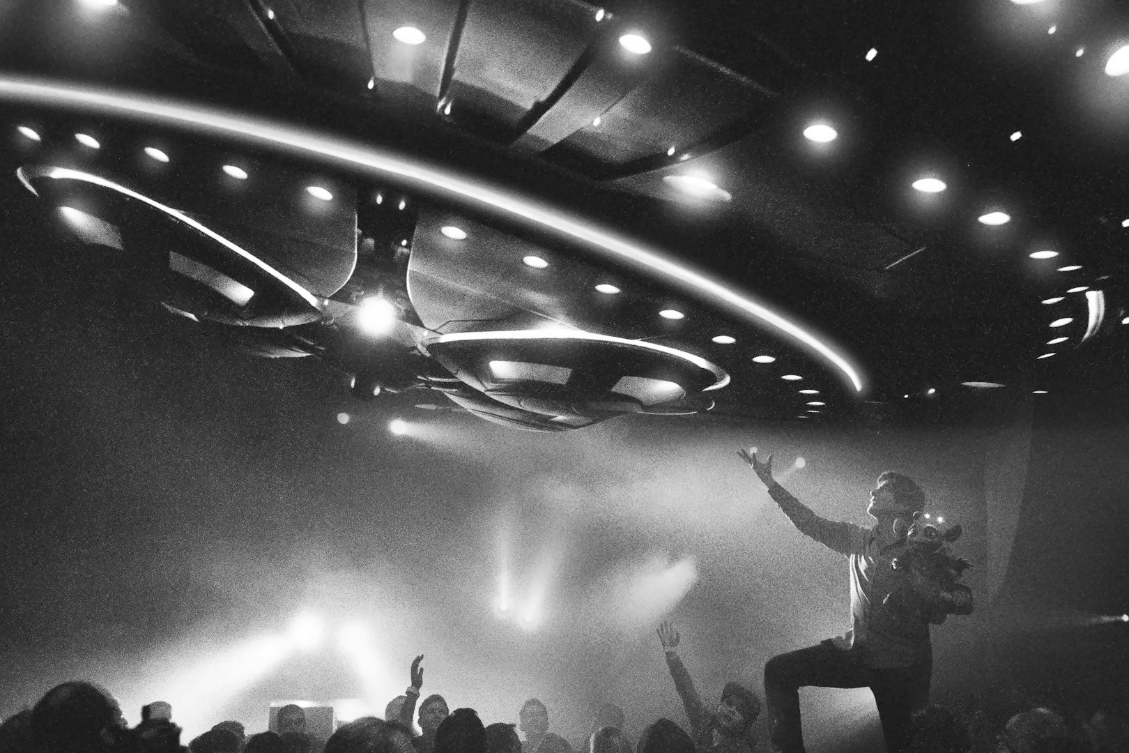 Magician performing under UFO lights at David Copperfield Vegas show.