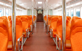 Ferry interior with orange seats on the Singapore to Batam route.
