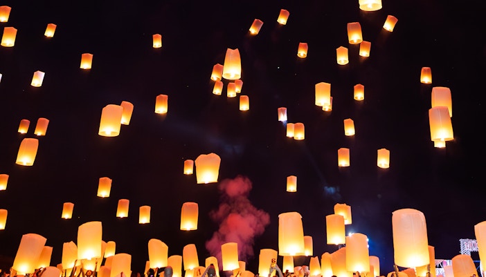Floating lanterns illuminate the night sky during Yi Peng and Loy Krathong Festival 2025.