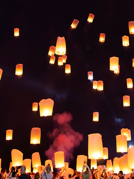 Floating lanterns illuminate the night sky during Yi Peng and Loy Krathong Festival 2025.