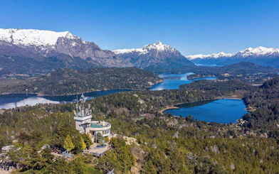 Llao Llao region with lakes, forests, and snow-capped mountains in the background.