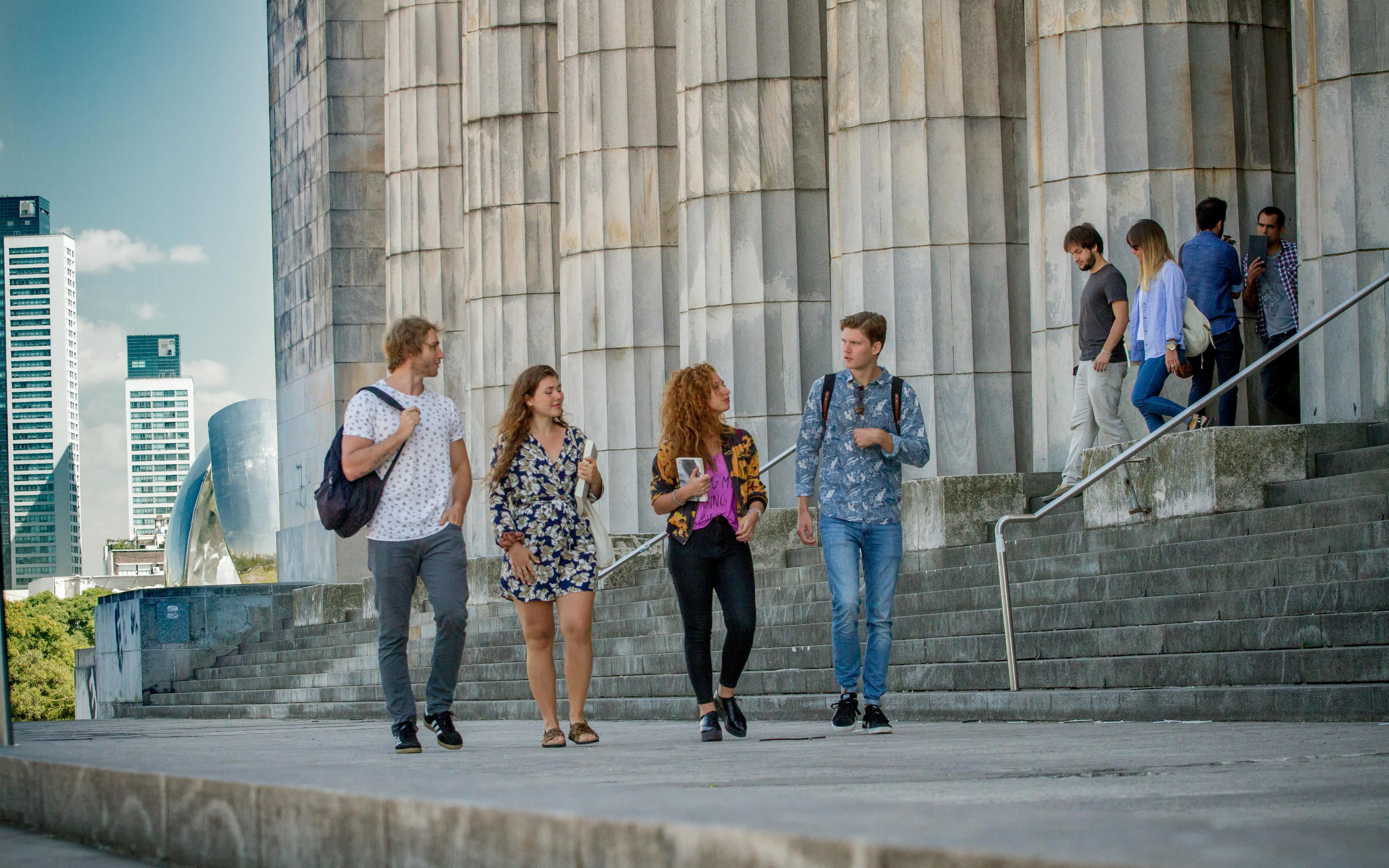 Visitors walking near the National Library in Buenos Aires during a city highlights tour.