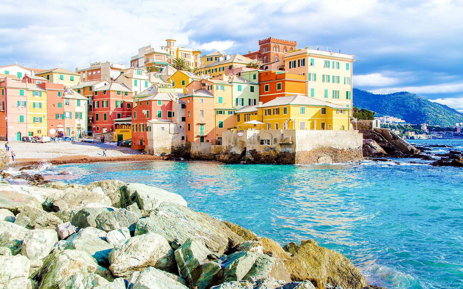 Colorful buildings along the rocky coast of Boccadasse, Genoa.