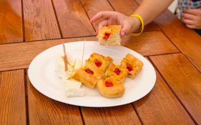 Snacks with cheese and focaccia served on Elaphite Islands Cruise by Karaka.