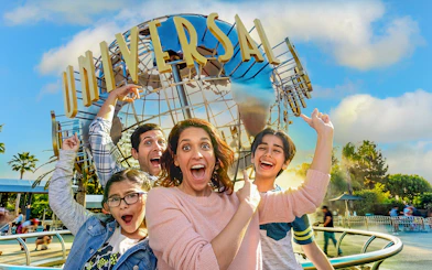 Excited group in front of Universal Studios Hollywood globe.
