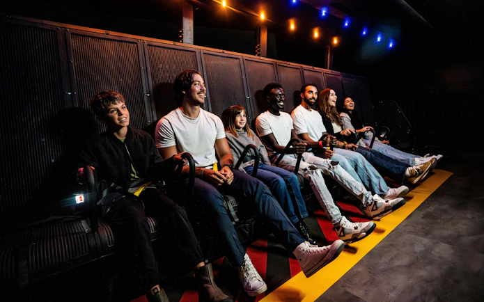 Visitors enjoying a flight simulation ride at Niagara Takes Flight, Canada.