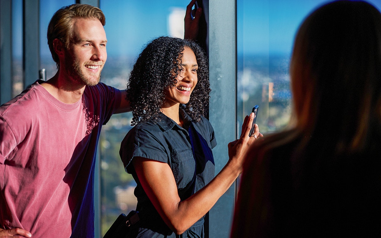 Visitors enjoying the view at Melbourne Skydeck during Cocktails in the Clouds Experience.