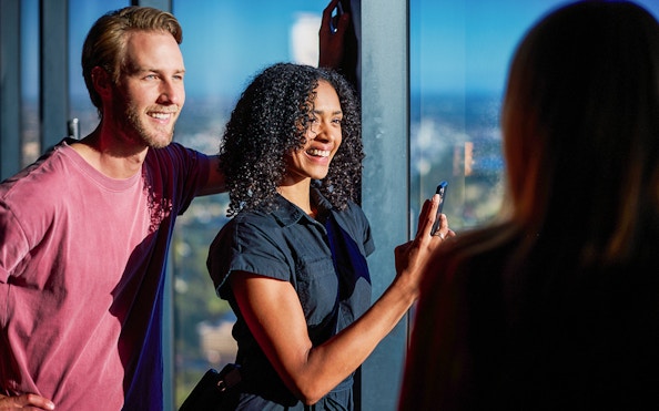 Visitors enjoying the view at Melbourne Skydeck during Cocktails in the Clouds Experience.