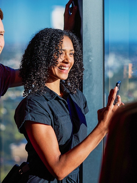 Visitors enjoying the view at Melbourne Skydeck during Cocktails in the Clouds Experience.