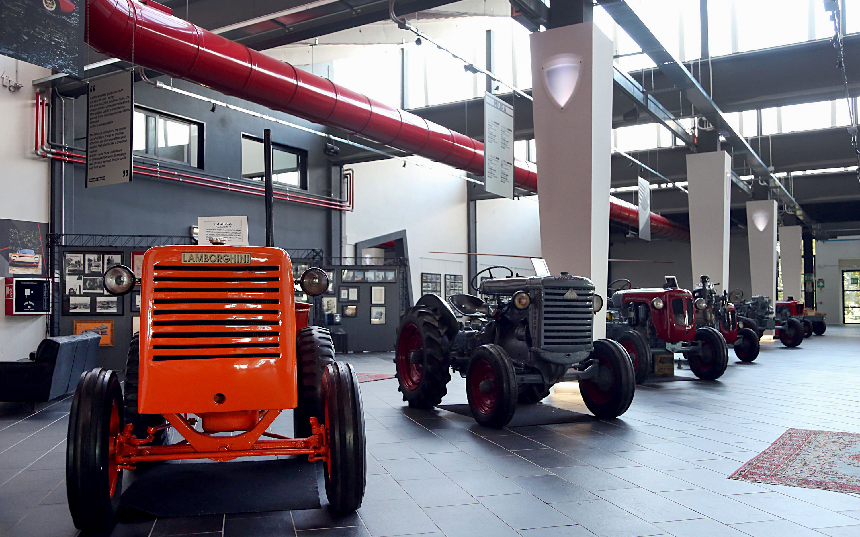 Vintage Lamborghini tractors displayed at Ferruccio Lamborghini Museum in Bologna, Italy.