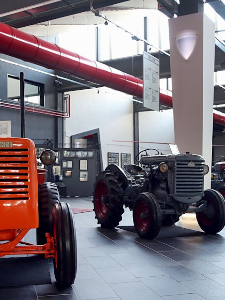 Vintage Lamborghini tractors displayed at Ferruccio Lamborghini Museum in Bologna, Italy.