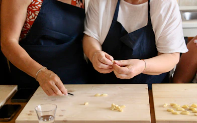 Participants shaping pasta at Polignano a Mare cooking class.