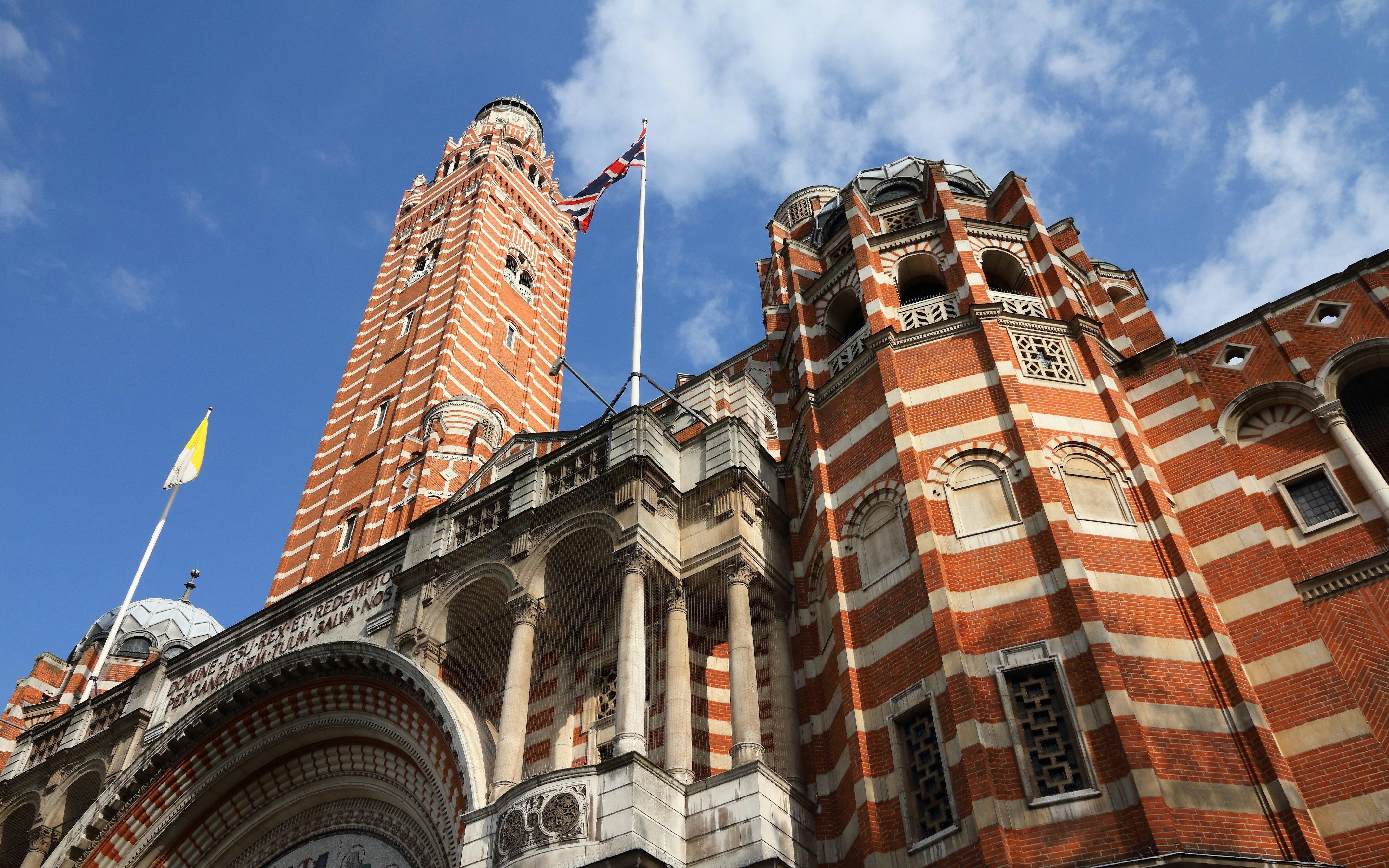 Westminster Cathedral's red brick facade and bell tower in London, UK.